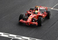 Massa crosses the line to win the 2008 Brazilian GP and almost the title.